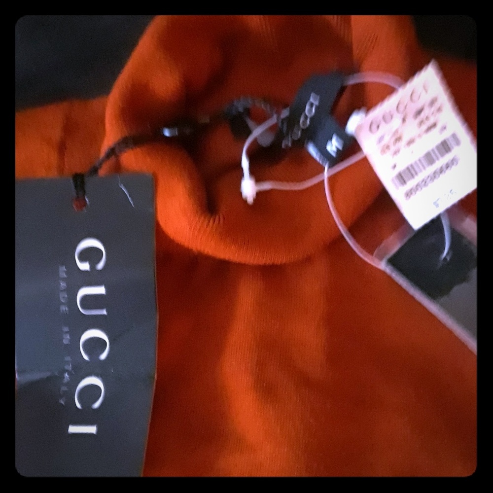 This is an original Gucci turtleneck silk orange r